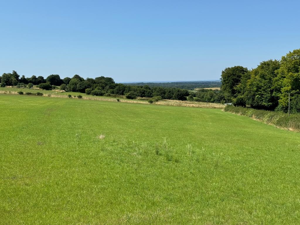 Lot: 75 - FARM BUILDINGS WITH POTENTIAL AND SIX ACRES IN A BEAUTIFUL RURAL SETTING - Looking Over the Site with the Views Beyond